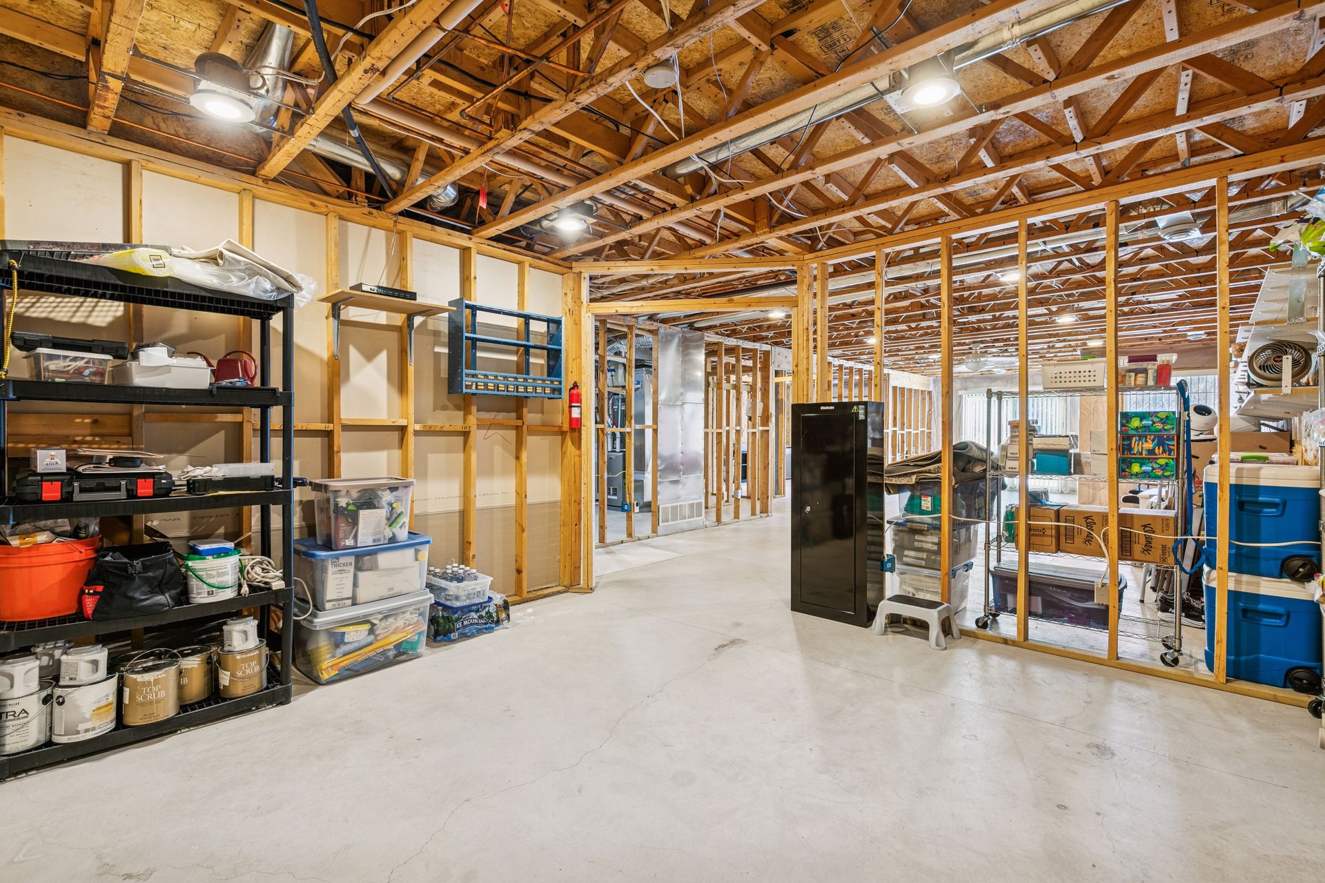 Unfinished lower level provides additional space ready for a second bedroom, and bathroom